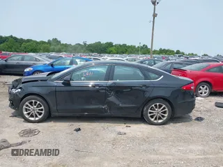 2020 Ford Fusion SE with VIN 3FA6P0LU5LR142665, listed as a IAAI auction lot 42415611 with 101,686 mi miles and . Bid and sale history available at DreamBid. Image 13.
