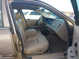 2005 Ford Crown Victoria LX with VIN 2FAFP74W55X130190, listed as a IAAI auction lot 41138306 with 122,738 mi miles. Bid and sale history available at carsss.com. Image 5.