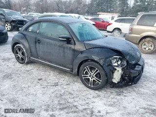 2012 Volkswagen Beetle 2.5L PZEV with VIN 3VWJP7AT8CM619137, listed as a IAAI auction lot 41195954 with 157,741 mi miles. Bid and sale history available at carsss.com. Image 1.