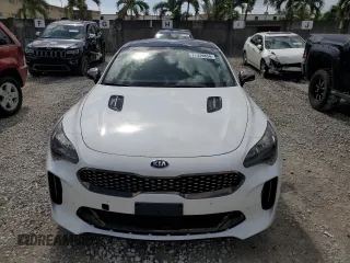 2021 Kia Stinger GT1 with VIN KNAE45LC9M6090262, listed as a Copart auction lot 77339854 with 3,354 mi miles and Salvage Title. Bid and sale history available at carsss.com. Image 5.
