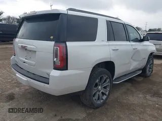 2019 GMC Yukon SLT with VIN 1GKS1BKCXKR329607, listed as a IAAI auction lot 41188239 with 84,940 mi miles. Bid and sale history available at carsss.com. Image 4.
