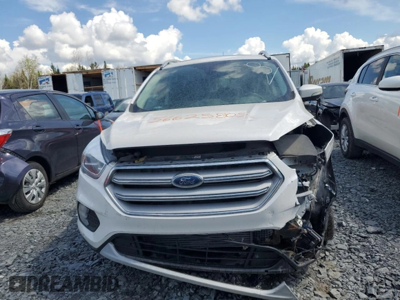 2018 Ford Escape Titanium z VIN 1FMCU9J94JUD09141, wystawiony jako Copart lot #56625805 z przebiegiem Nie podano mil oraz Szkoda całkowita • Salvage title. Historia ofert i sprzedaży dostępna na DreamBid. Obrazek 5.