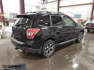 2015 Subaru Forester 2.0XT Touring with VIN JF2SJGUC9FH548304, listed as a IAAI auction lot 41728543 with 114,450 mi miles. Bid and sale history available at carsss.com. Image 4.