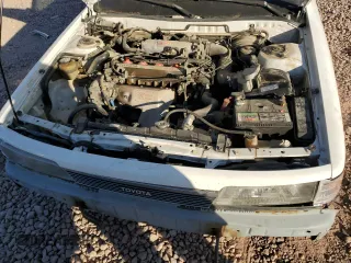 1989 Toyota Camry z VIN 4T1SV24E5KU019985, wystawiony jako Copart lot #81200104 z przebiegiem 207 103 mil mil oraz Szkoda całkowita • Salvage title. Historia ofert i sprzedaży dostępna na DreamBid. Obrazek 11.