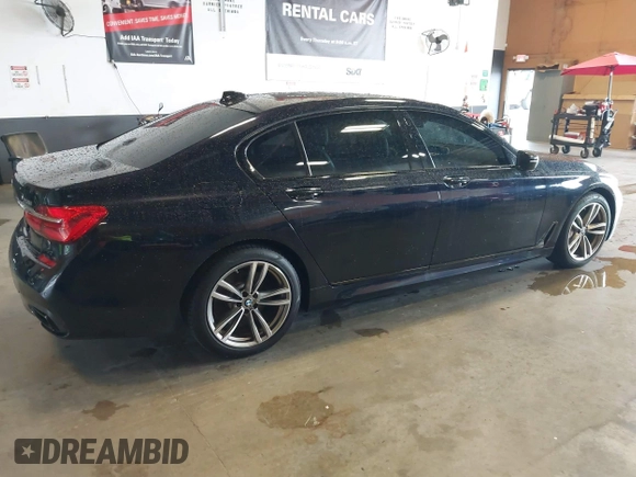 2019 BMW 7 Series 750i xDrive with VIN WBA7F2C51KB239044, listed as a IAAI auction lot 42756026 with 65,028 mi miles and . Bid and sale history available at DreamBid. Image 4.