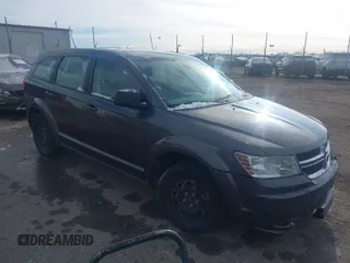 2015 Dodge Journey SE z VIN 3C4PDCAB9FT649909, wystawiony jako IAAI lot #41949629 z przebiegiem 208 588 mil mil oraz . Historia ofert i sprzedaży dostępna na DreamBid. Obrazek 1.