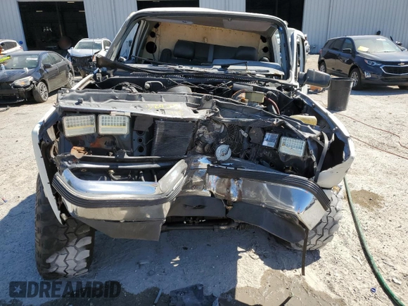 1990 GMC Jimmy z VIN 1GKEV18K4LF509467, wystawiony jako Copart lot #52405495 z przebiegiem 409 007 mil mil oraz Nie do naprawy • Non repairable. Historia ofert i sprzedaży dostępna na DreamBid. Obrazek 5.