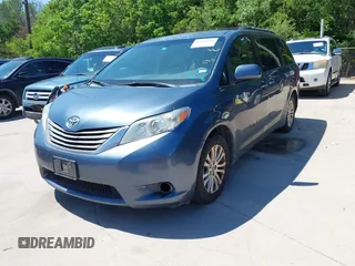2014 Toyota Sienna XLE with VIN 5TDYK3DC5ES481399, listed as a IAAI auction lot 42085550 with 154,157 mi miles. Bid and sale history available at carsss.com. Image 2.