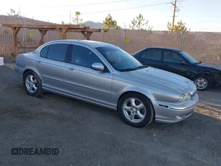 2004 Jaguar X-Type with VIN SAJEA51C44WD87863, listed as a IAAI auction lot 41318937 with 148,050 mi miles. Bid and sale history available at carsss.com. Image 1.