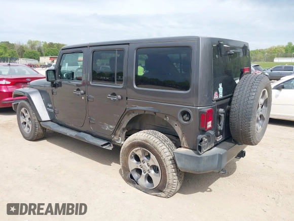 2017 Jeep Wrangler Unlimited Sahara with VIN 1C4BJWEGXHL595724, listed as a IAAI auction lot 42018264 with 95,948 mi miles. Bid and sale history available at carsss.com. Image 3.