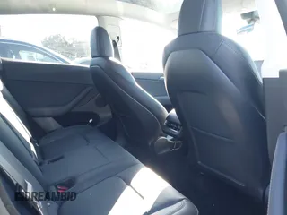 2022 Tesla Model Y Performance with VIN 7SAYGDEF7NF562895, listed as a IAAI auction lot 41692864 with 29,904 mi miles and . Bid and sale history available at DreamBid. Image 8.