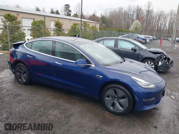 2018 Tesla Model 3 Long Range Battery with VIN 5YJ3E1EA9JF022782, listed as a IAAI auction lot 41875429 with 79,209 mi miles. Bid and sale history available at carsss.com. Image 1.