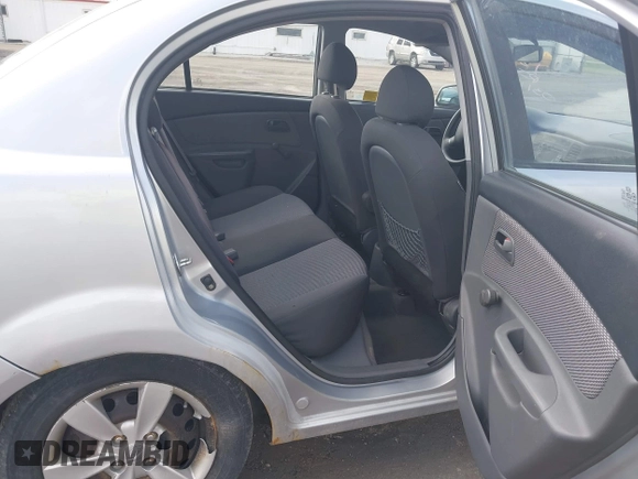 2009 Kia Rio LX with VIN KNADE223796521410, listed as a IAAI auction lot 41887883 with 82,360 mi miles and . Bid and sale history available at DreamBid. Image 8.