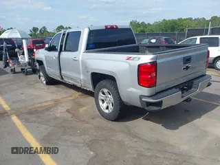 2017 Chevrolet Silverado 1500 LT with VIN 3GCUKREC5HG285689, listed as a IAAI auction lot 42055959 with 128,237 mi miles and . Bid and sale history available at DreamBid. Image 3.
