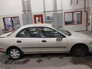 1998 Mazda Protege DX z VIN JM1BC1419W0171802, wystawiony jako IAAI lot #42202861 z przebiegiem 252 304 mil mil oraz . Historia ofert i sprzedaży dostępna na DreamBid. Obrazek 13.