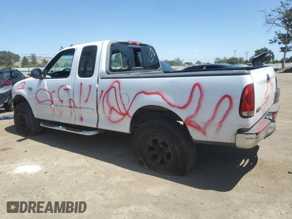 1999 Ford F-150 with VIN 1FTZX1727XKA70271, listed as a Copart auction lot 58016095 with 219,093 mi miles and Salvage title. Bid and sale history available at DreamBid. Image 2.