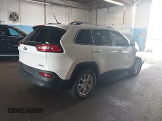 2015 Jeep Cherokee Latitude with VIN 1C4PJMCBXFW784869, listed as a IAAI auction lot 41951297 with 138,396 mi miles. Bid and sale history available at carsss.com. Image 4.