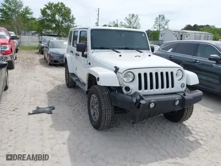 2015 Jeep Wrangler Unlimited Rubicon Hard Rock with VIN 1C4HJWFG7FL684057, listed as a IAAI auction lot 41963885 with 103,240 mi miles. Bid and sale history available at carsss.com. Image 6.