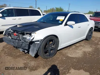 2012 Chrysler 300 SRT-8 with VIN 2C3CCAFJ9CH801749, listed as a IAAI auction lot 40912606 with 144,404 mi miles and . Bid and sale history available at DreamBid. Image 2.