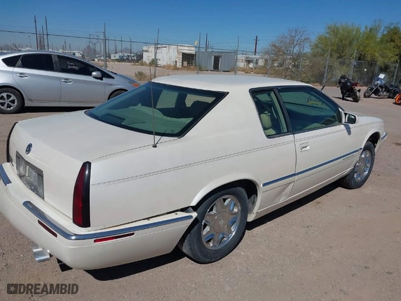 1999 Cadillac Eldorado ESC with VIN 1G6EL12Y9XU613018, listed as a IAAI auction lot 41827794 with 1 mi miles. Bid and sale history available at carsss.com. Image 4.