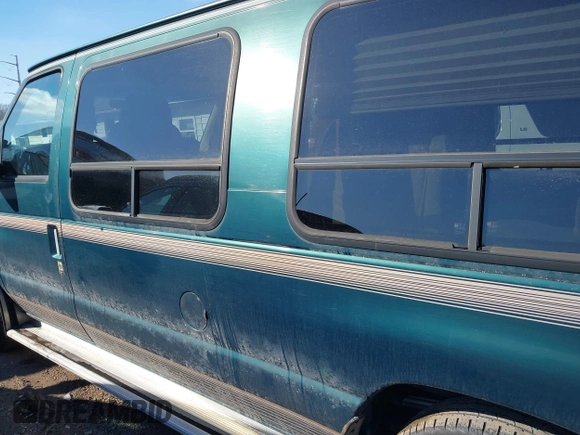 1999 Ford Econoline Cargo with VIN 1FDRE14W3XHB36482, listed as a IAAI auction lot 41393346 with 130,669 mi miles. Bid and sale history available at carsss.com. Image 14.