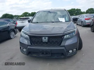 2021 Honda Passport EX-L z VIN 5FNYF7H53MB008238, wystawiony jako IAAI lot #42017959 z przebiegiem 55 411 mil mil oraz . Historia ofert i sprzedaży dostępna na DreamBid. Obrazek 13.