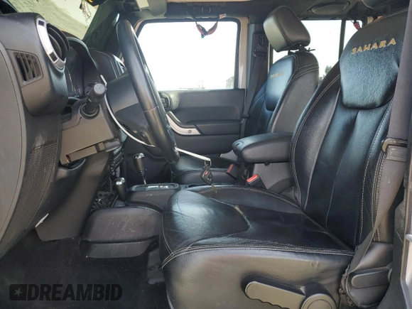 2014 Jeep Wrangler Unlimited Sahara with VIN 1C4HJWEG1EL126611, listed as a Copart auction lot 57169485 with 122,000 mi miles and Salvage title. Bid and sale history available at DreamBid. Image 7.