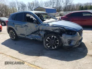 2016 Mazda CX-5 Grand Touring with VIN JM3KE2DY9G0724096, listed as a Copart auction lot 52249675 with 47,860 mi miles and Salvage Title. Bid and sale history available at carsss.com. Image 4.