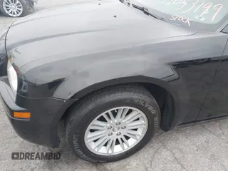2009 Chrysler 300 LX with VIN 2C3KA43D19H506753, listed as a IAAI auction lot 42053199 with 106,092 mi miles. Bid and sale history available at carsss.com. Image 12.