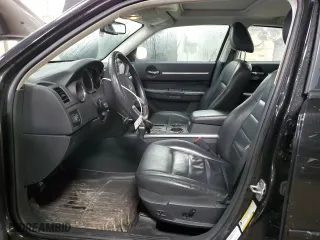 2010 Dodge Charger Road/Track with VIN 2B3CA8CT8AH288444, listed as a Copart auction lot 49392795 with 104,119 mi miles and Salvage Title. Bid and sale history available at carsss.com. Image 7.