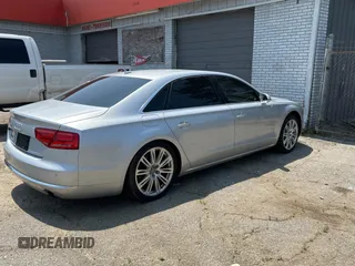 2013 Audi A8 3.0L with VIN WAURGAFD6DN010072, listed as a Copart auction lot 57999295 with 116,555 mi miles and Salvage title. Bid and sale history available at DreamBid. Image 4.