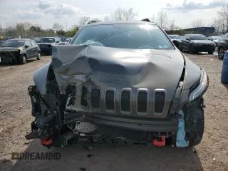 2015 Jeep Cherokee Trailhawk with VIN 1C4PJMBSXFW687205, listed as a Copart auction lot 53128545 with 86,876 mi miles and Salvage Title. Bid and sale history available at carsss.com. Image 5.