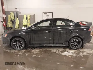 2015 Mitsubishi Lancer SE with VIN JA32V2FW6FU019508, listed as a IAAI auction lot 41633196 with 91,758 mi miles. Bid and sale history available at carsss.com. Image 14.