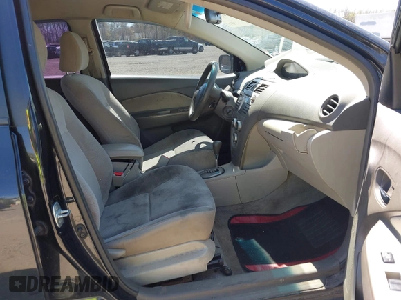 2009 Toyota Yaris with VIN JTDBT903294057773, listed as a IAAI auction lot 42071027 with 164,128 mi miles. Bid and sale history available at carsss.com. Image 5.