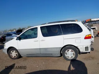 2000 Toyota Sienna LE z VIN 4T3ZF13C3YU278612, wystawiony jako IAAI lot #42018517 z przebiegiem 165 147 mil mil oraz . Historia ofert i sprzedaży dostępna na DreamBid. Obrazek 14.