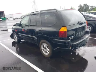 2007 GMC Envoy SLE with VIN 1GKDS13S872309605, listed as a IAAI auction lot 41946509 with 184,638 mi miles. Bid and sale history available at carsss.com. Image 3.