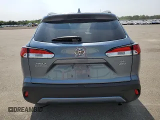 2023 Toyota Corolla Cross LE with VIN 7MUCAABG4PV054828, listed as a Copart auction lot 59466855 with 23,884 mi miles and Salvage title. Bid and sale history available at DreamBid. Image 6.