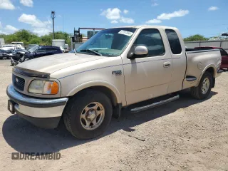 1998 Ford F-150 XL with VIN 1FTRX07L6WKB62554, listed as a Copart auction lot 67597854 with 100,528 mi miles and Salvage Title. Bid and sale history available at carsss.com. Image 1.