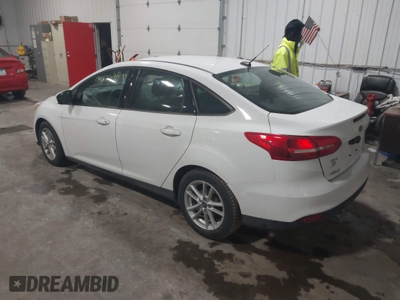 2018 Ford Focus SE with VIN 1FADP3F29JL312721, listed as a IAAI auction lot 41012098 with 126,214 mi miles. Bid and sale history available at carsss.com. Image 3.
