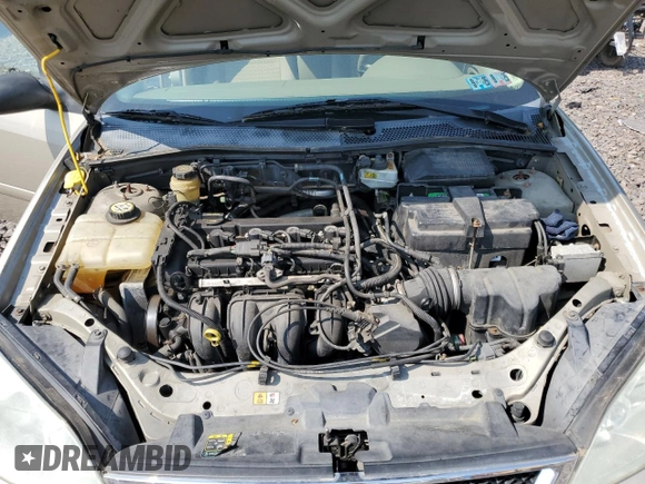 2006 Ford Focus S z VIN 1FAFP34N96W111431, wystawiony jako Copart lot #59478815 z przebiegiem Nie podano mil oraz Szkoda całkowita • Salvage title. Historia ofert i sprzedaży dostępna na DreamBid. Obrazek 11.