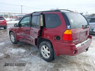 2008 GMC Envoy SLE2 with VIN 1GKDT13S182132619, listed as a IAAI auction lot 41605231 with 138,458 mi miles. Bid and sale history available at carsss.com. Image 3.