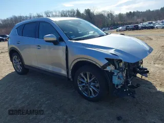 2021 Mazda CX-5 Grand Touring Reserve with VIN JM3KFBAY5M0472988, listed as a IAAI auction lot 41897855 with 27,318 mi miles. Bid and sale history available at carsss.com. Image 1.
