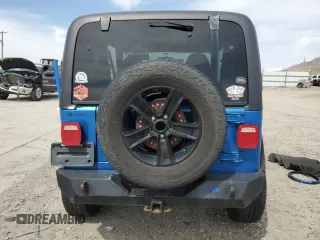 2002 Jeep Wrangler Sport with VIN 1J4FA49S32P762794, listed as a Copart auction lot 52132955 with 243,499 mi miles and Salvage Title. Bid and sale history available at carsss.com. Image 6.