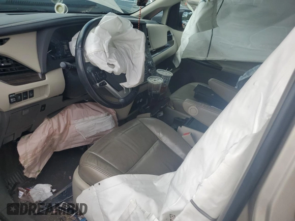 2016 Toyota Sienna XLE with VIN 5TDYK3DC0GS697468, listed as a Copart auction lot 51186795 with 128,851 mi miles and Salvage Title. Bid and sale history available at DreamBid. Image 7.