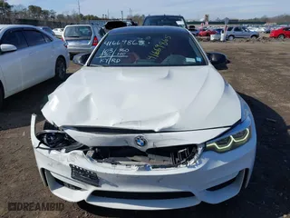 2019 BMW M4 with VIN WBS4Y9C5XKAG67446, listed as a IAAI auction lot 41669865 with 103,230 mi miles. Bid and sale history available at carsss.com. Image 12.