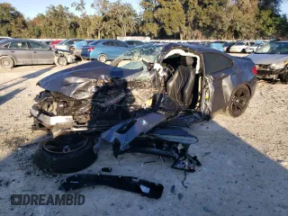 2018 BMW M2 with VIN WBS1J5C50J7B70191, listed as a Copart auction lot 86976284 with 0 mi miles and Salvage Title. Bid and sale history available at carsss.com. Image 1.