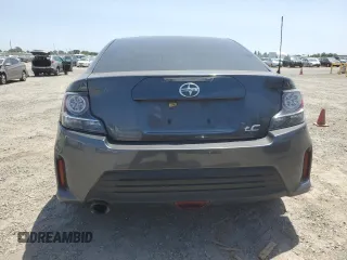 2015 Scion tC z VIN JTKJF5C76FJ010813, wystawiony jako Copart lot #58987575 z przebiegiem 108 709 mil mil oraz Szkoda całkowita • Salvage title. Historia ofert i sprzedaży dostępna na DreamBid. Obrazek 6.
