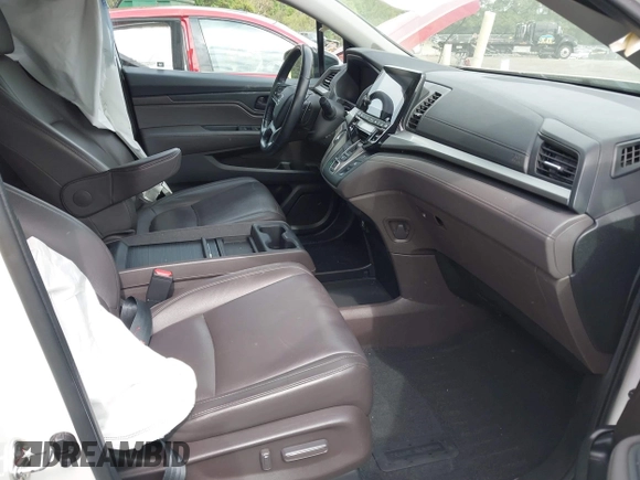 2018 Honda Odyssey EX-L with VIN 5FNRL6H77JB047919, listed as a IAAI auction lot 42112505 with 108,706 mi miles and . Bid and sale history available at DreamBid. Image 5.