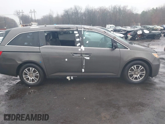 2012 Honda Odyssey EX-L with VIN 5FNRL5H64CB037689, listed as a IAAI auction lot 41857822 with 121,601 mi miles and . Bid and sale history available at carsss.com. Image 13.