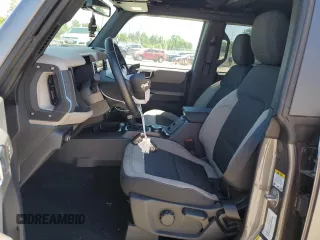 2023 Ford Bronco with VIN 1FMEE5DP6PLB66975, listed as a Copart auction lot 57536014 with 11,883 mi miles and Salvage Title. Bid and sale history available at DreamBid. Image 7.